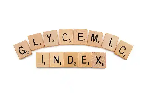 glycemic index written on wooden slab=